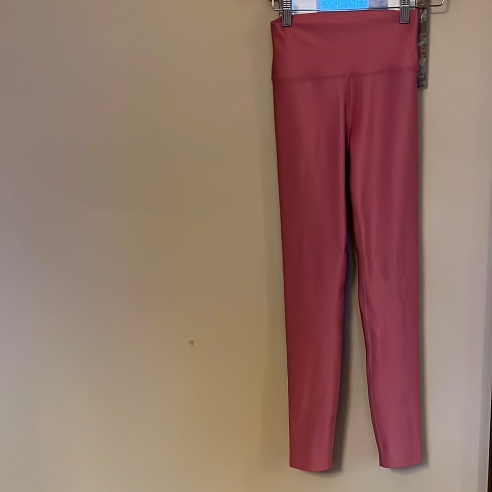 Peloton Size Small pinkish/red color leggings.